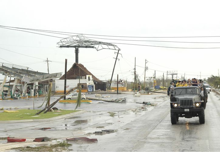 Military helping people after Wilma Hurricane hits Cancun
