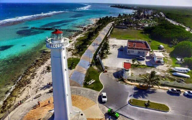 Aerial view of Mahahual lighthouse and coast. One of the destinations available for Cancun Airport Transportation