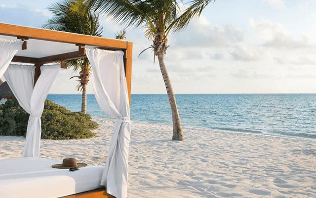 Bali bed at Playa Mujeres beach. One of the destinations available for Cancun Airport Transportation