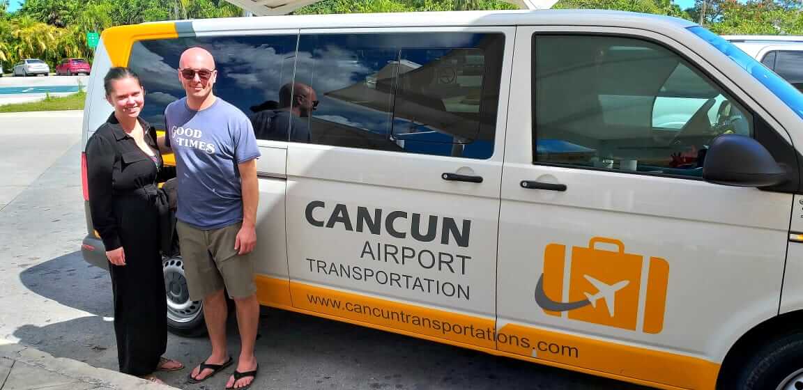 Customers. Happy couple, man and woman, smiling at Cancun Airport after receiving a Cancun Airport Transportation service
