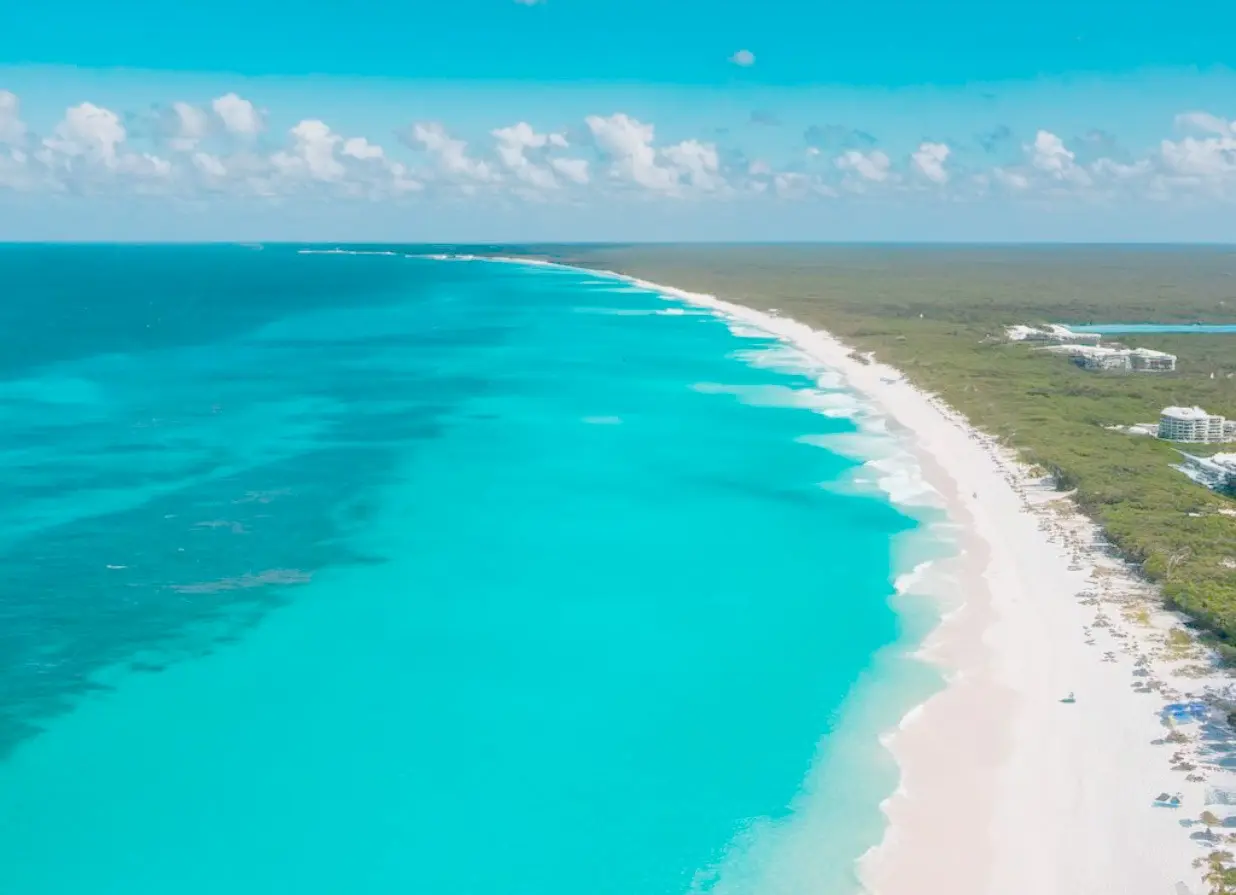 Aerial view of the turquoise beaches of Isla Blanca. One of the destinations available for Cancun Airport Transportation